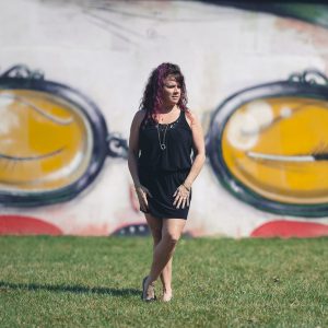 panorama of woman in front of mural in annapolis