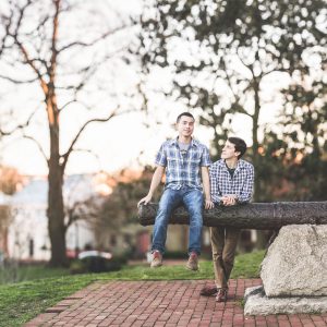 couple sitting on canon in annapolis